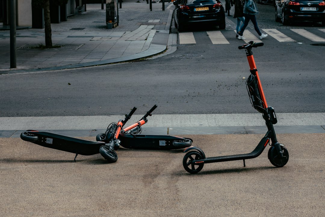 Scooters parked by an urban road for an electric scooter buying guide